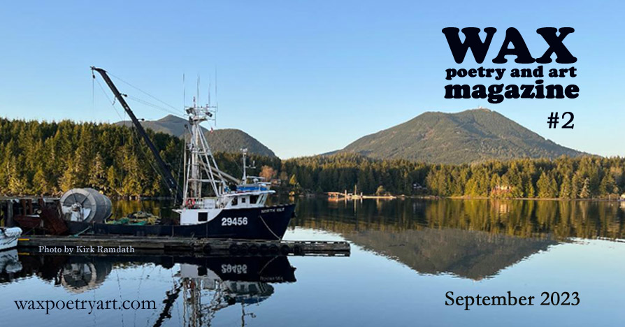 Image shows a black and white fishing boat with a crane type apparatus in the aft section.
		It is a side view of the boat, which is docked flush against a narrow plank. The reflection of the boat in the water is pristine, along with the forest, mountain, and clear blue sky behind the boat.